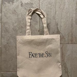 Seventeen embroidered tote bags